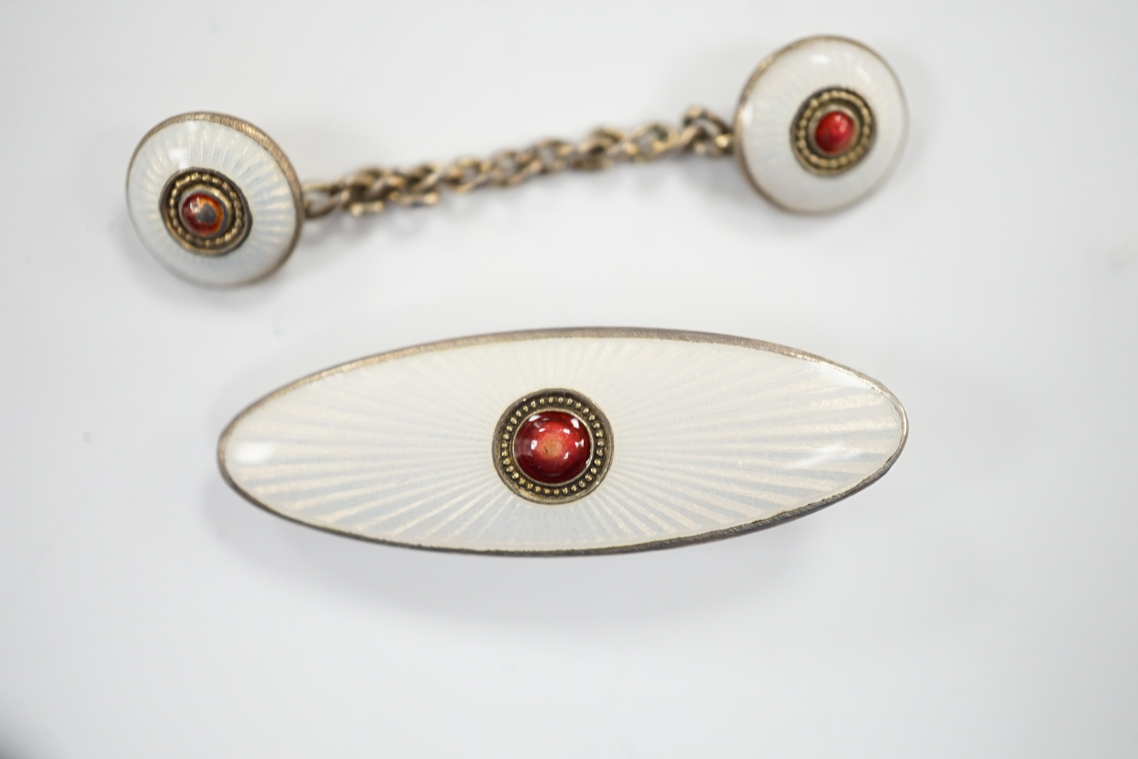 An early 20th century Russian 84 zolotnik and two colour enamel tie clip, 33mm and cloak clasp.